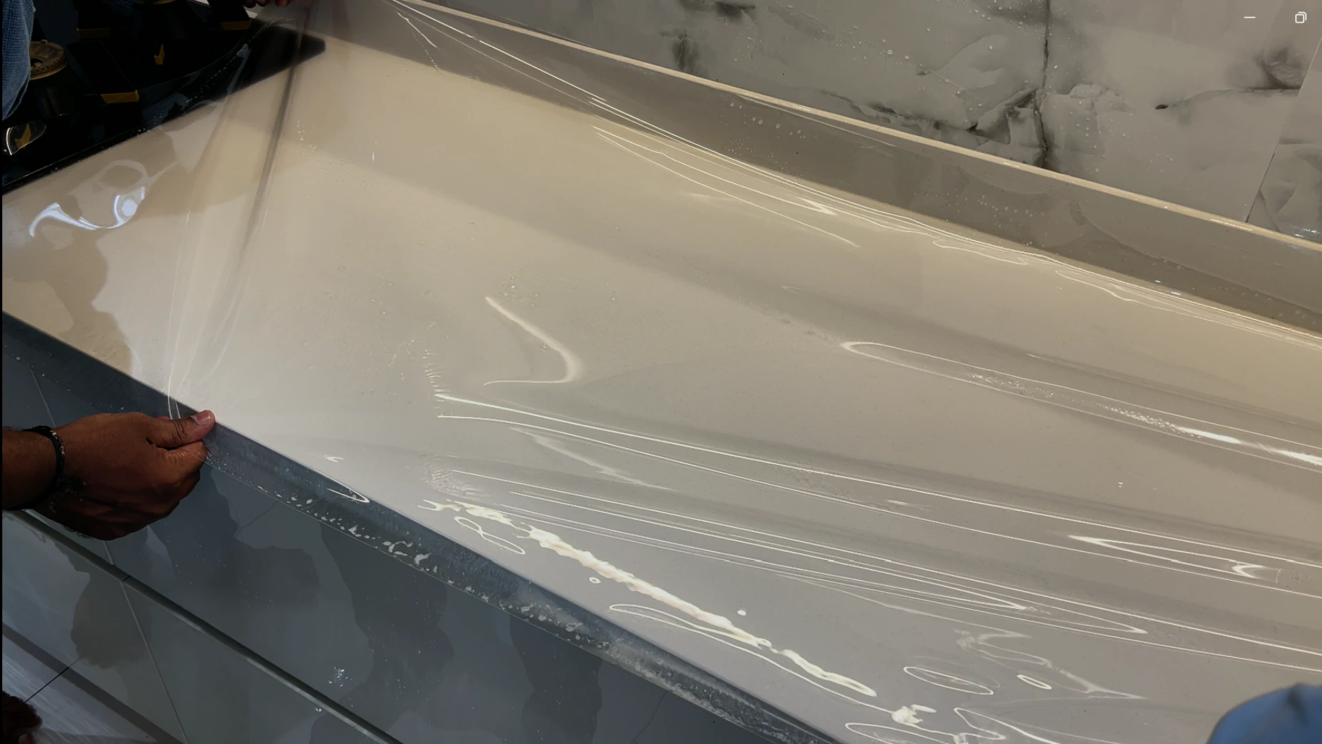 Kitchen countertop protection film application process